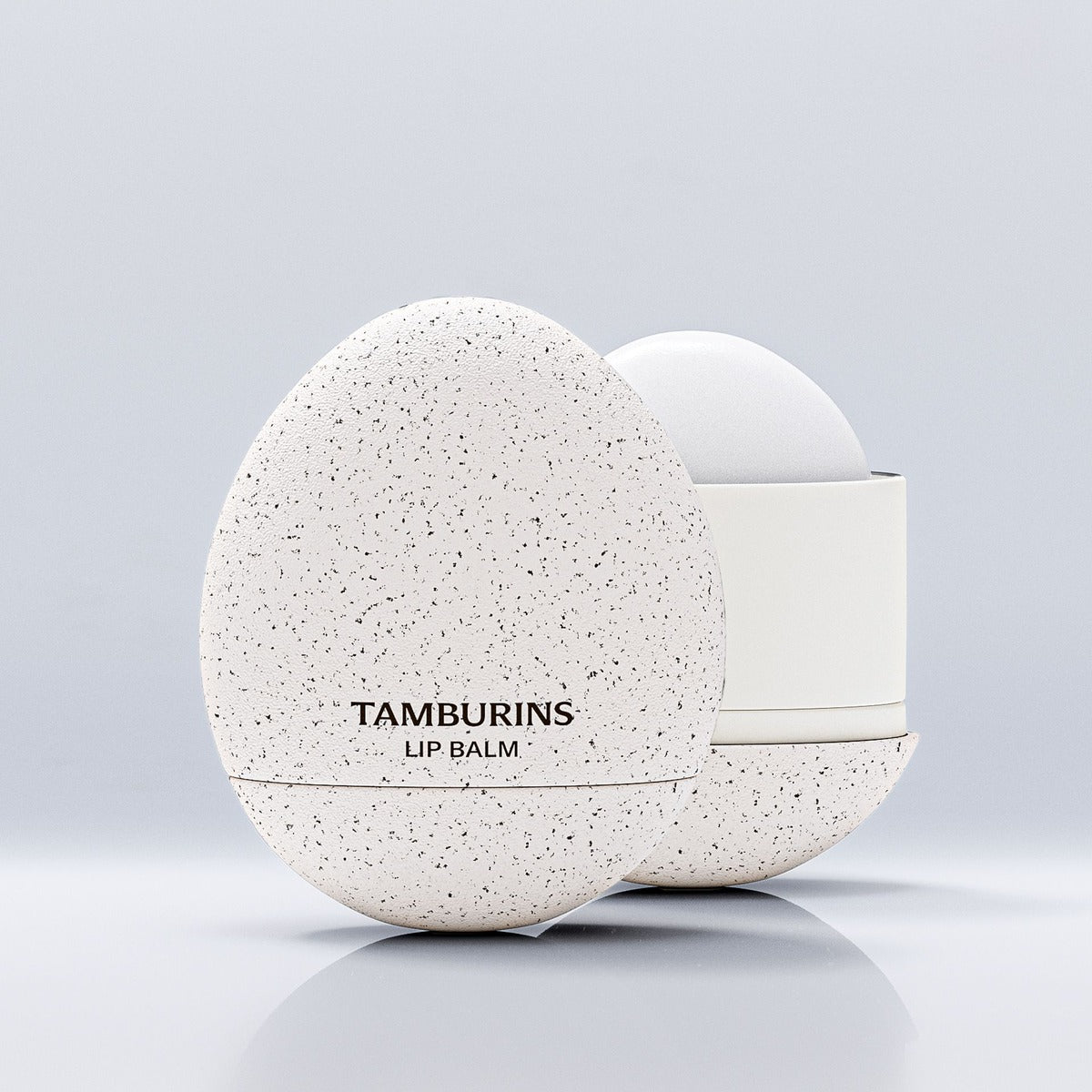 TAMBURINS Egg Lip Balm Milk Tea 5g in its egg-shaped case